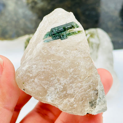 close up of the green tourmaline on this crystal 