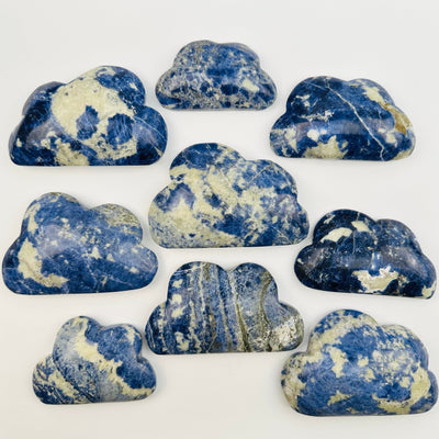 multiple sodalite clouds displayed to show the differences in the sizes and color shades 