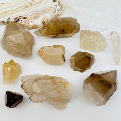 multiple crystals displayed to show the differences in the sizes and color shades 