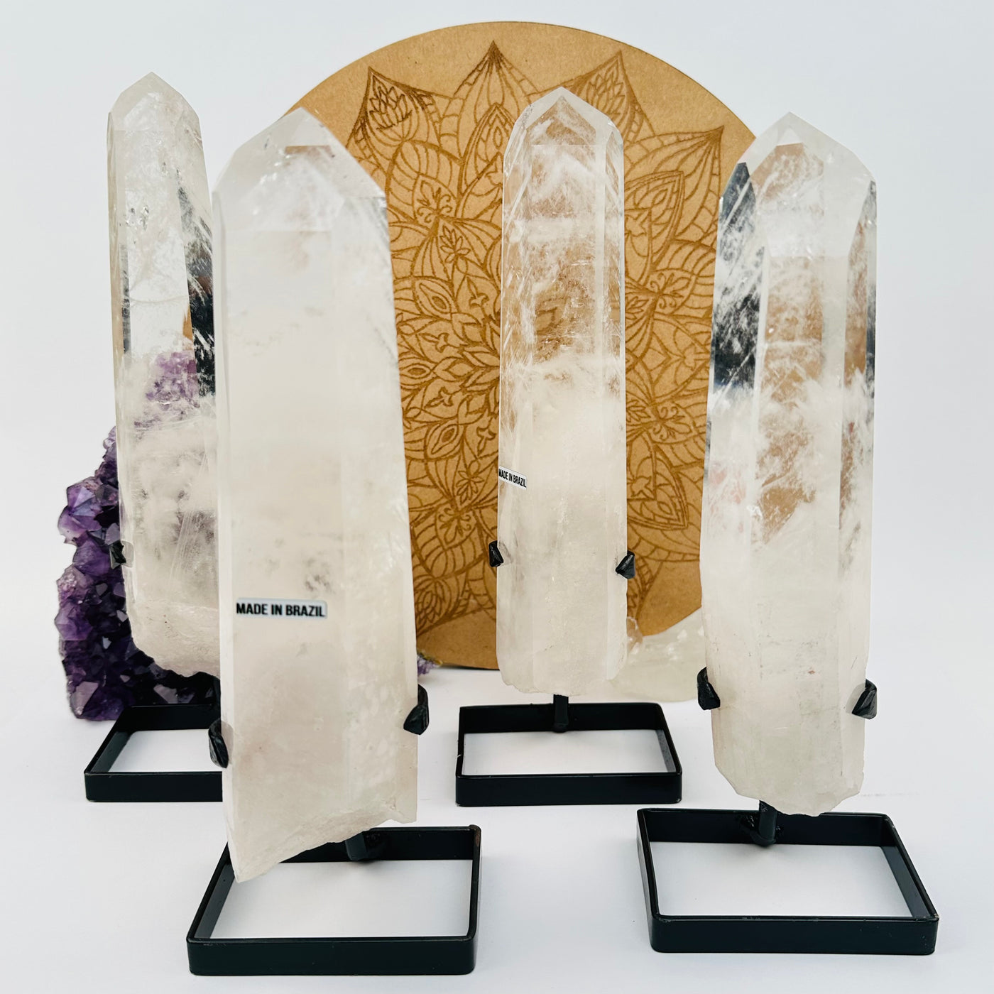 multiple Crystal Quartz Point with Phantoms on Stands displayed to show the differences in the sizes 