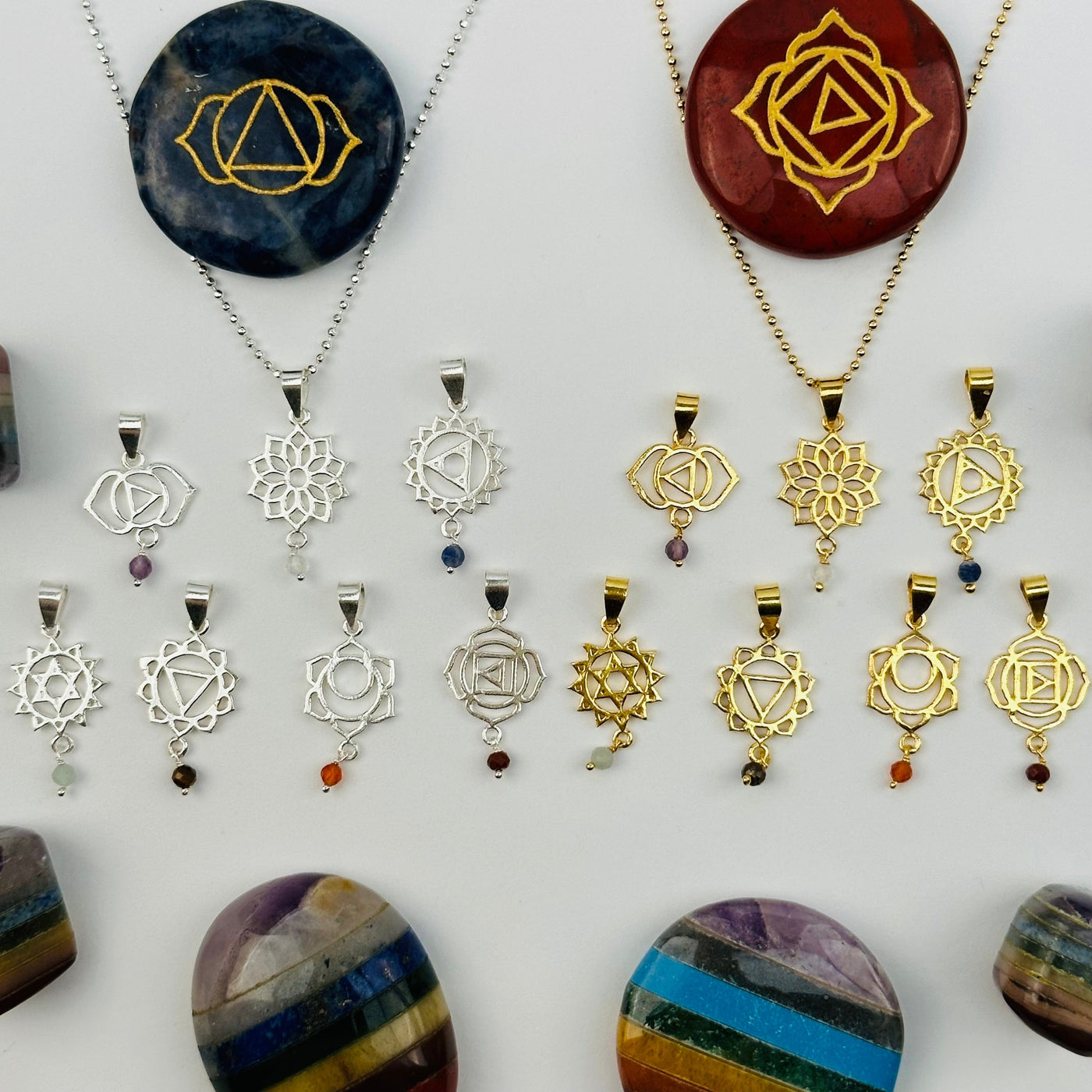 pendants displayed to show the differences in the gemstones and chakras 
