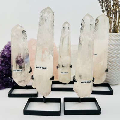 multiple Crystal Quartz Points with Phantoms on Stand displayed to show the differences in the sizes 