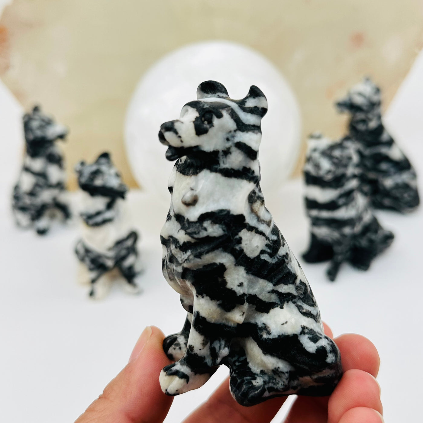 zebra jasper carved crystal dog in hand for size reference 