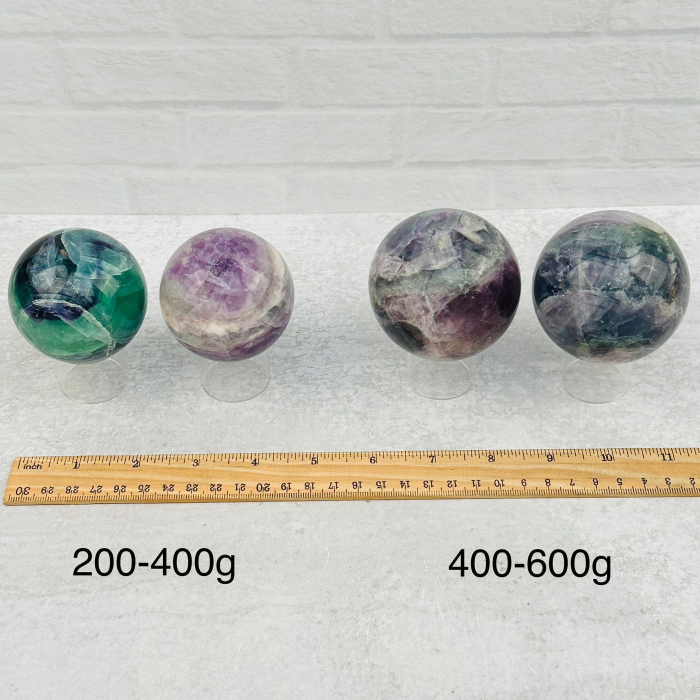 spheres displayed next to a ruler for size reference 