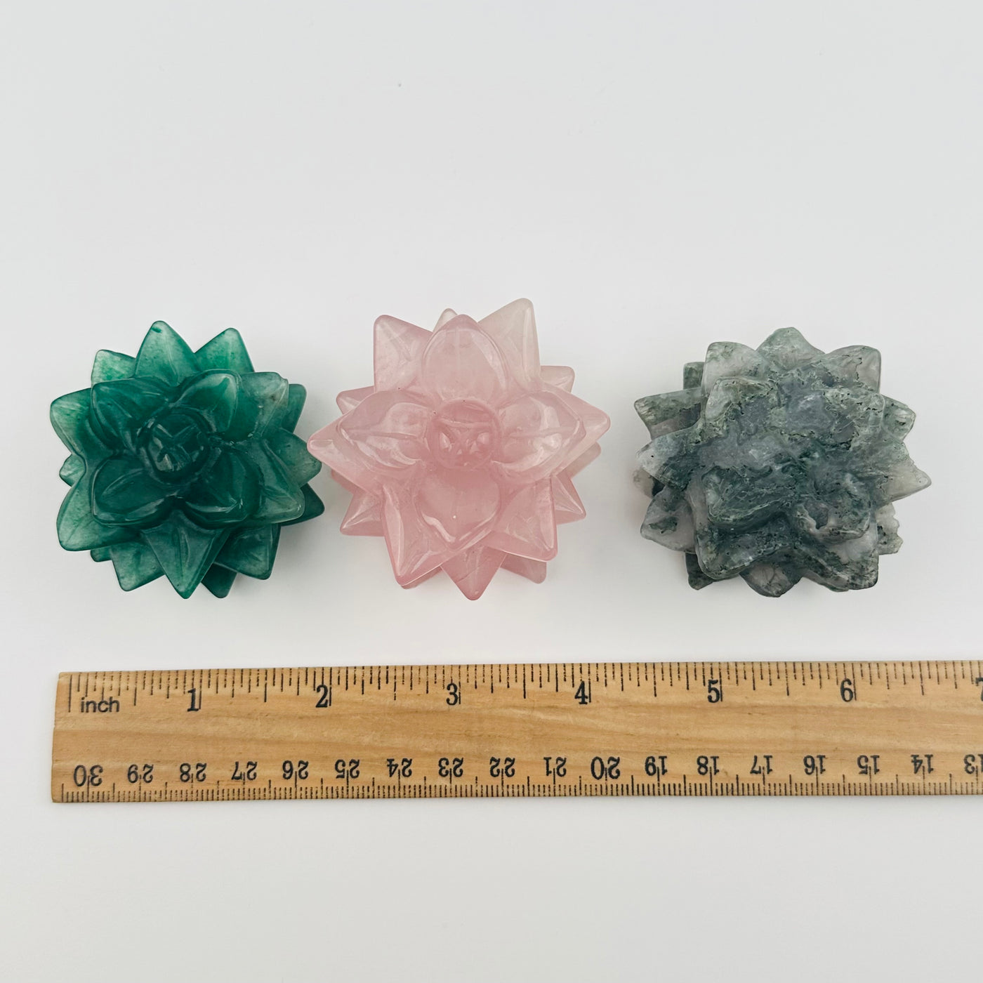 crystals displayed next to a ruler for size reference 