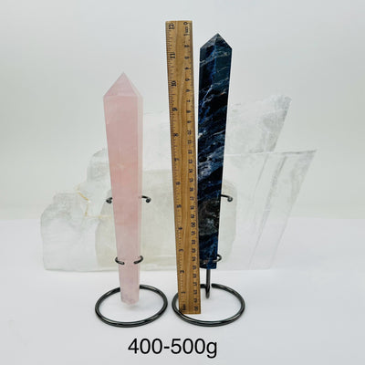 crystal wands on metal stand come sold by weight. displayed next to a ruler for size reference