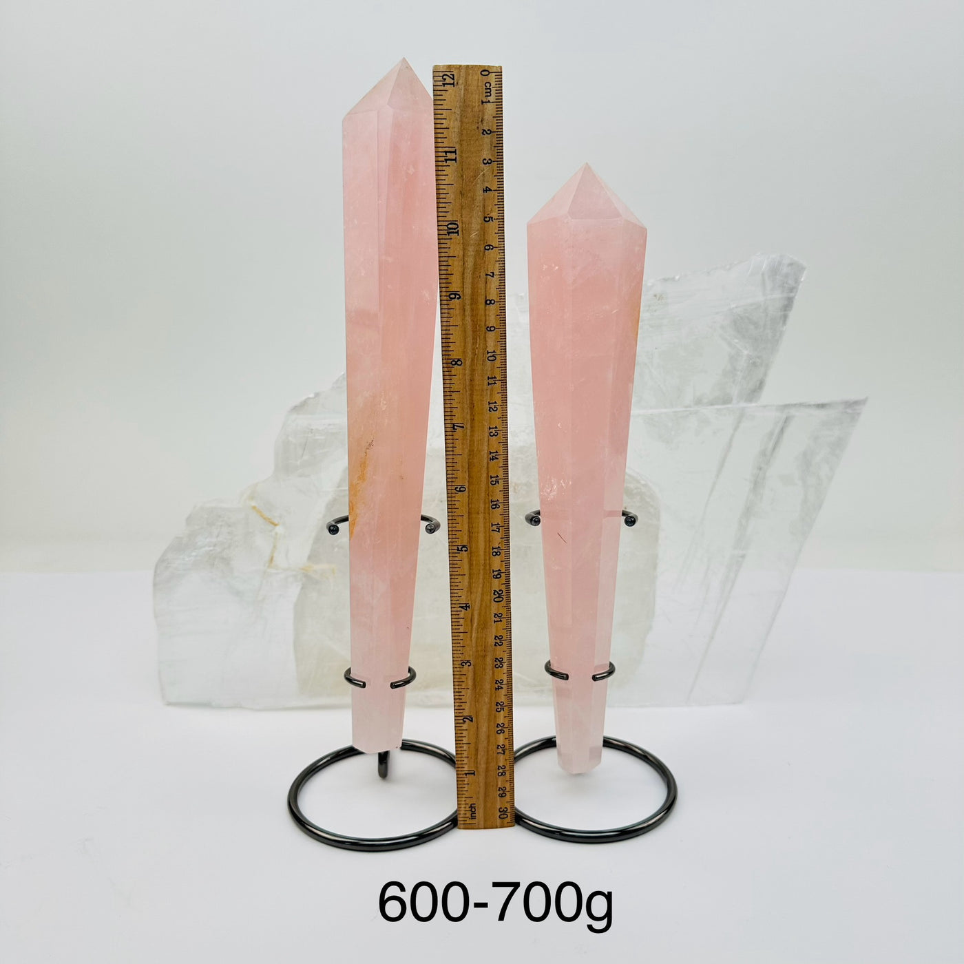 crystal wands on metal stand come sold by weight. displayed next to a ruler for size reference