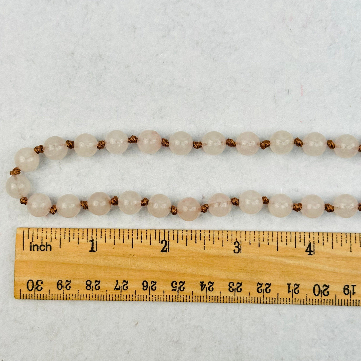 close up of the beads next to a ruler 