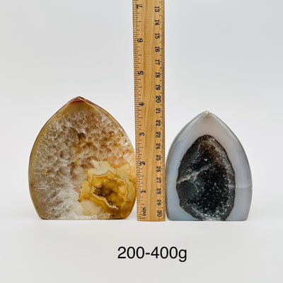 agate points are sold by weight, next to a ruler for size reference 