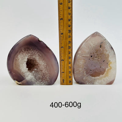 agate points are sold by weight, next to a ruler for size reference 