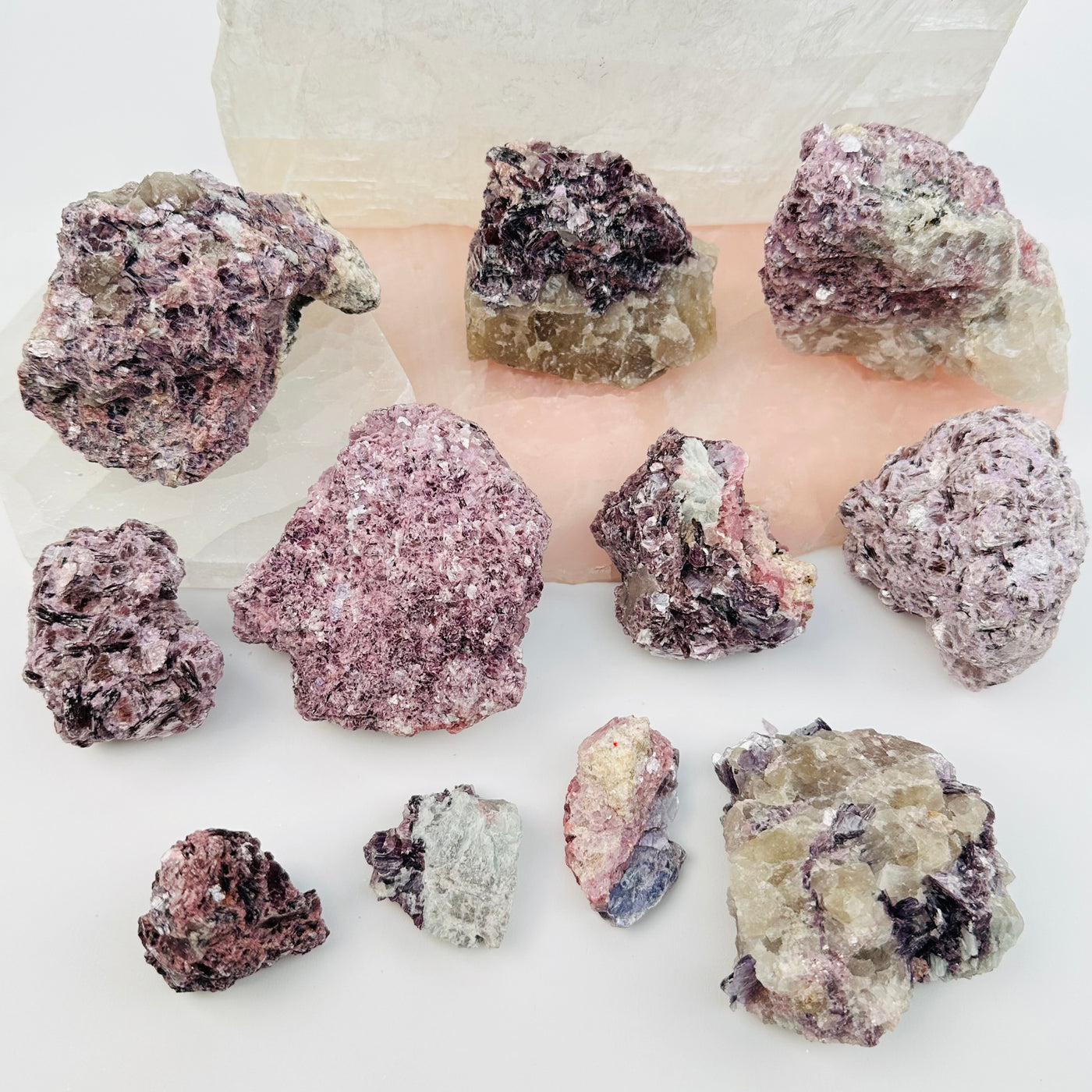 multiple crystals displayed to show the differences in the sizes and color shades 