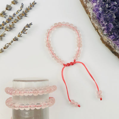 Crystal Rose Quartz Faceted Rondelle Bracelets displayed to show the differences in the color shades and sizes 