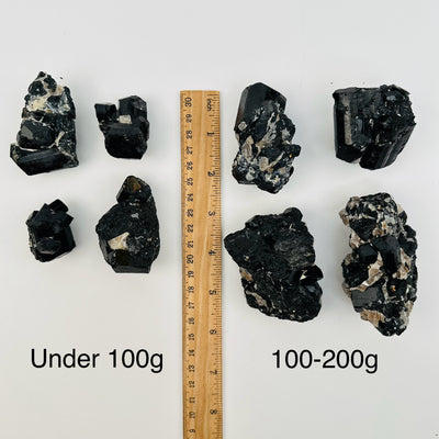 crystals sold by weight. displayed next to a ruler for size reference 