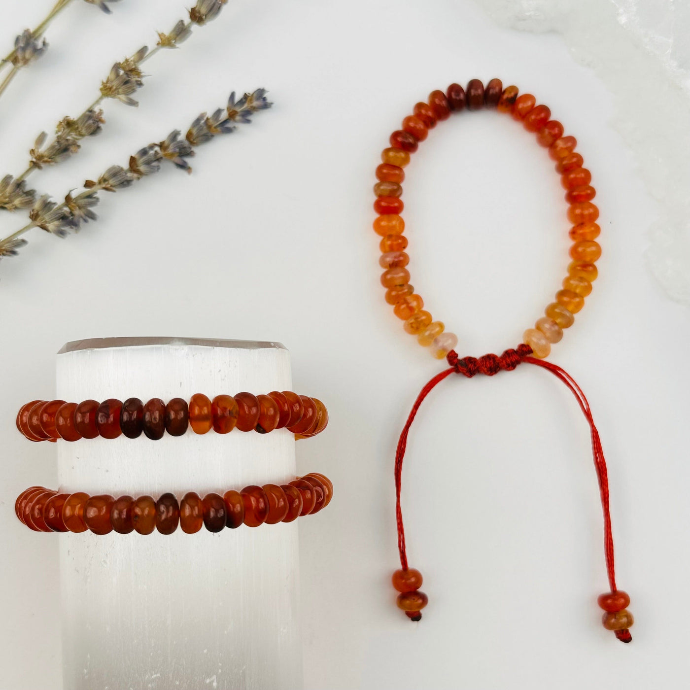Crystal Carnelian Rondelle Bracelets displayed to show the differences in the color shades 