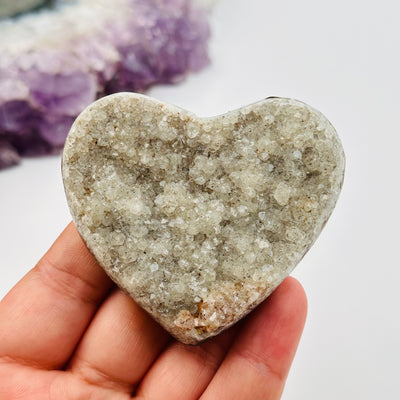 amethyst druzy heart in hand for size reference 