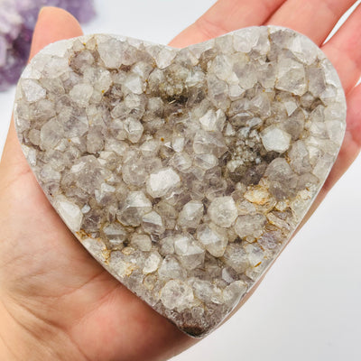 amethyst druzy heart in hand for size reference