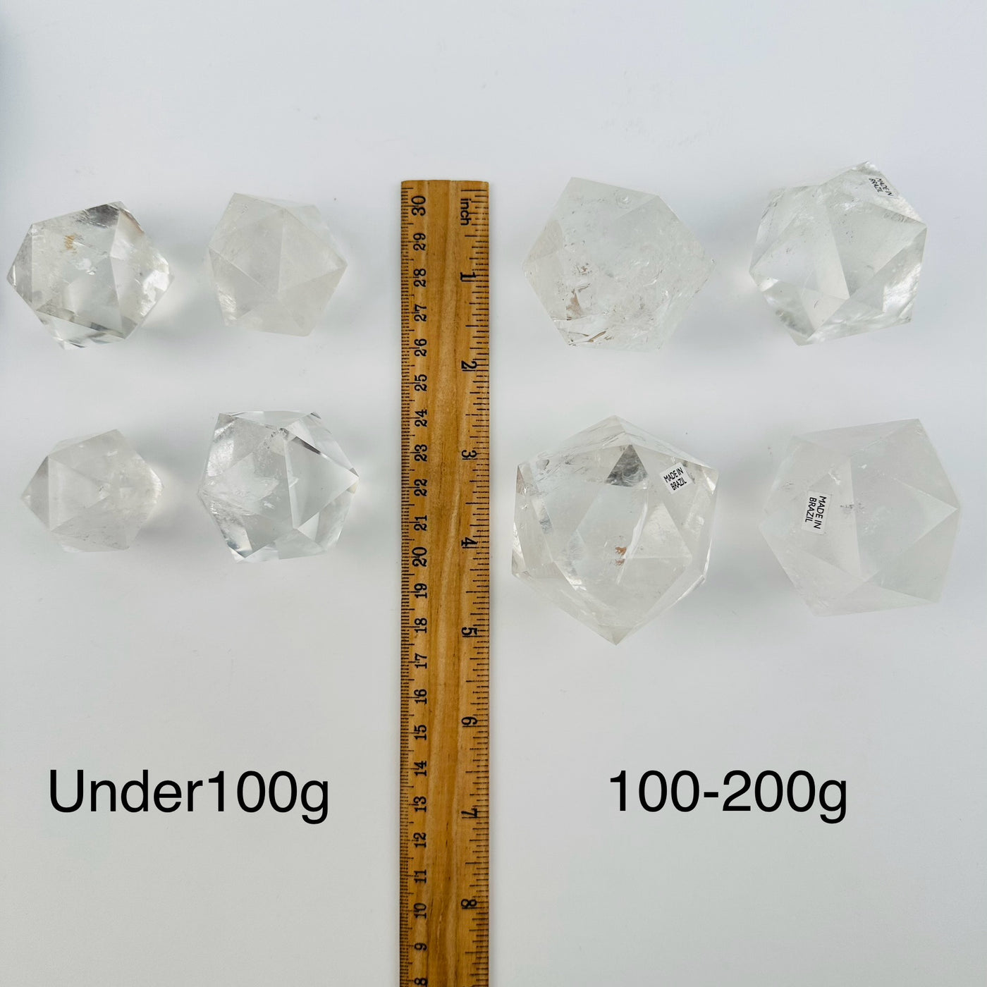 crystal quartz icosahedron sold by weight. next to a ruler for size reference 