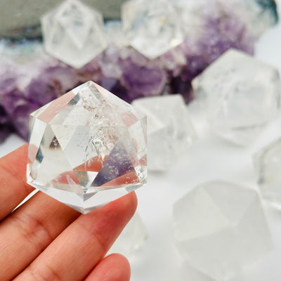 crystal icosahedron in hand for size reference 