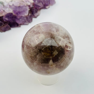 seven minerals in one polished sphere displayed as home decor