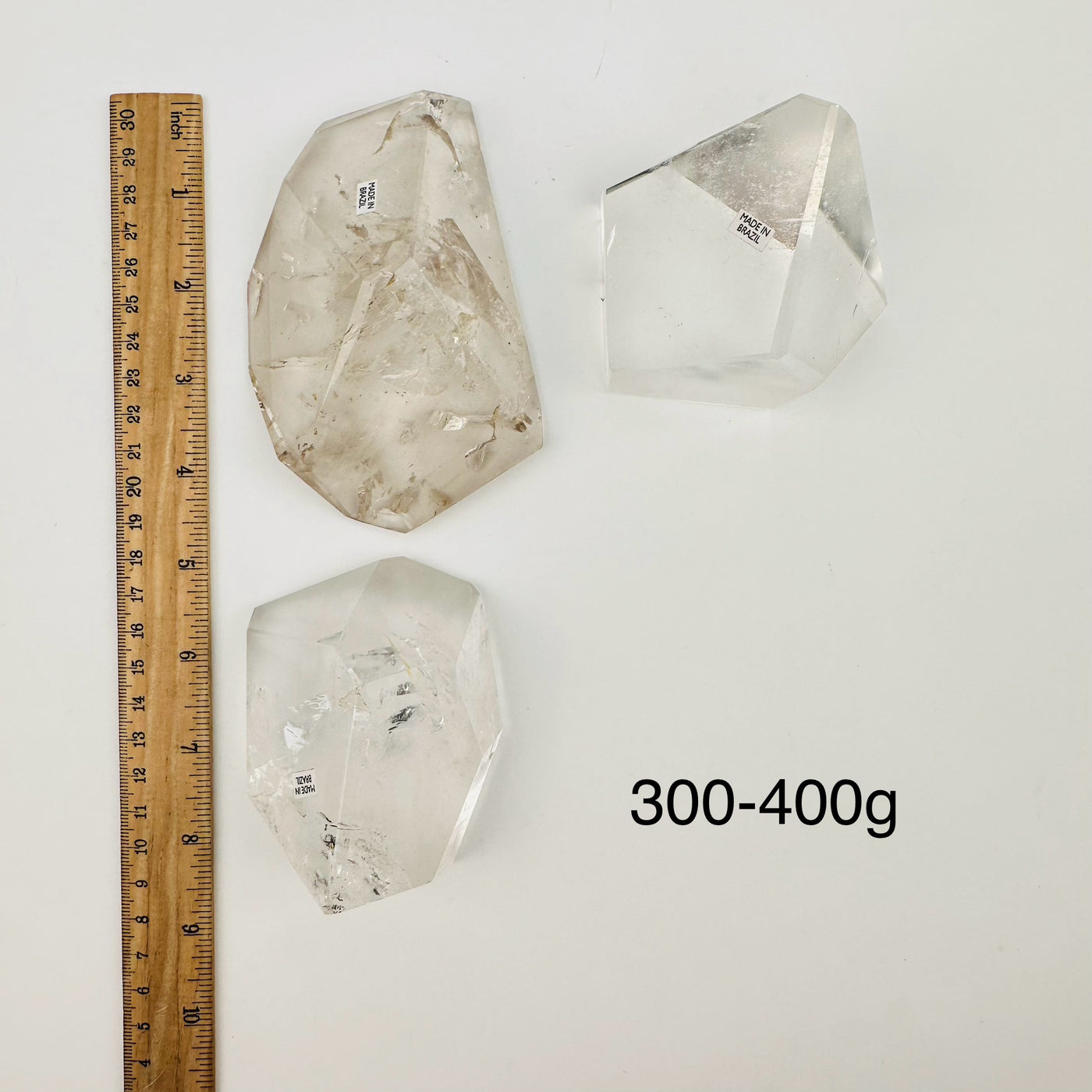 free formed crystals sold by weight. displayed next to a ruler for size reference 