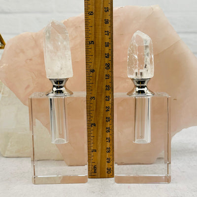 Crystal Quartz Point Top Perfume Bottles next to a ruler for size reference 