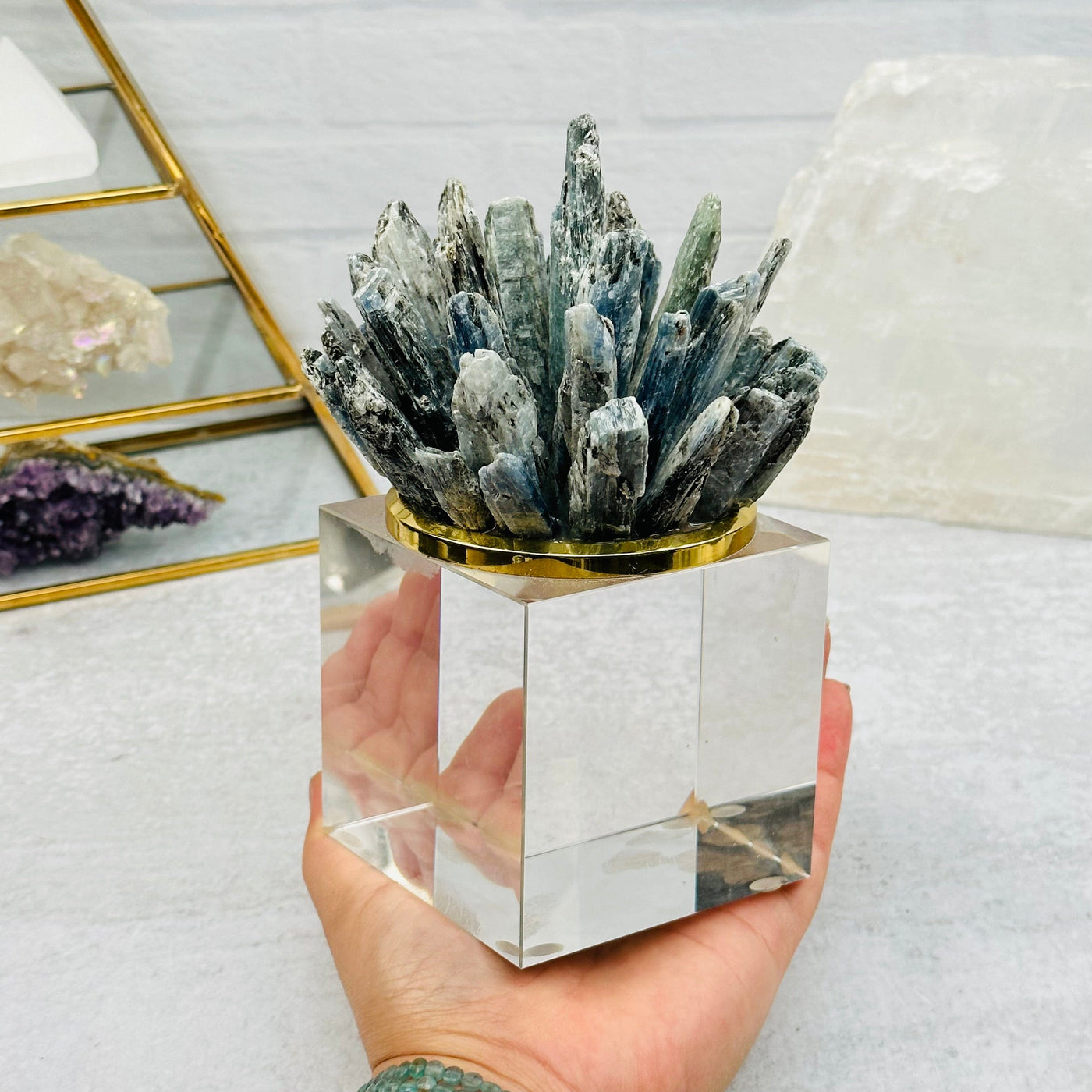 Blue Kyanite Pinecone on Glass Base in hand for size reference 