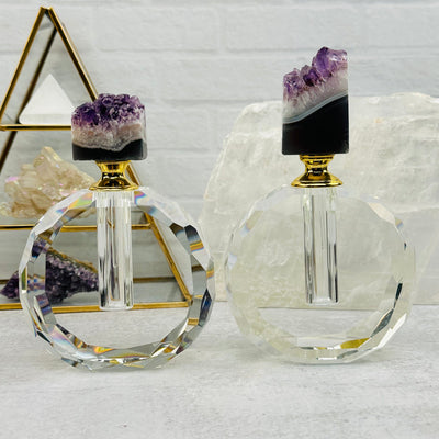 multiple bottles displayed to show the differences in the crystal sizes and color shades 
