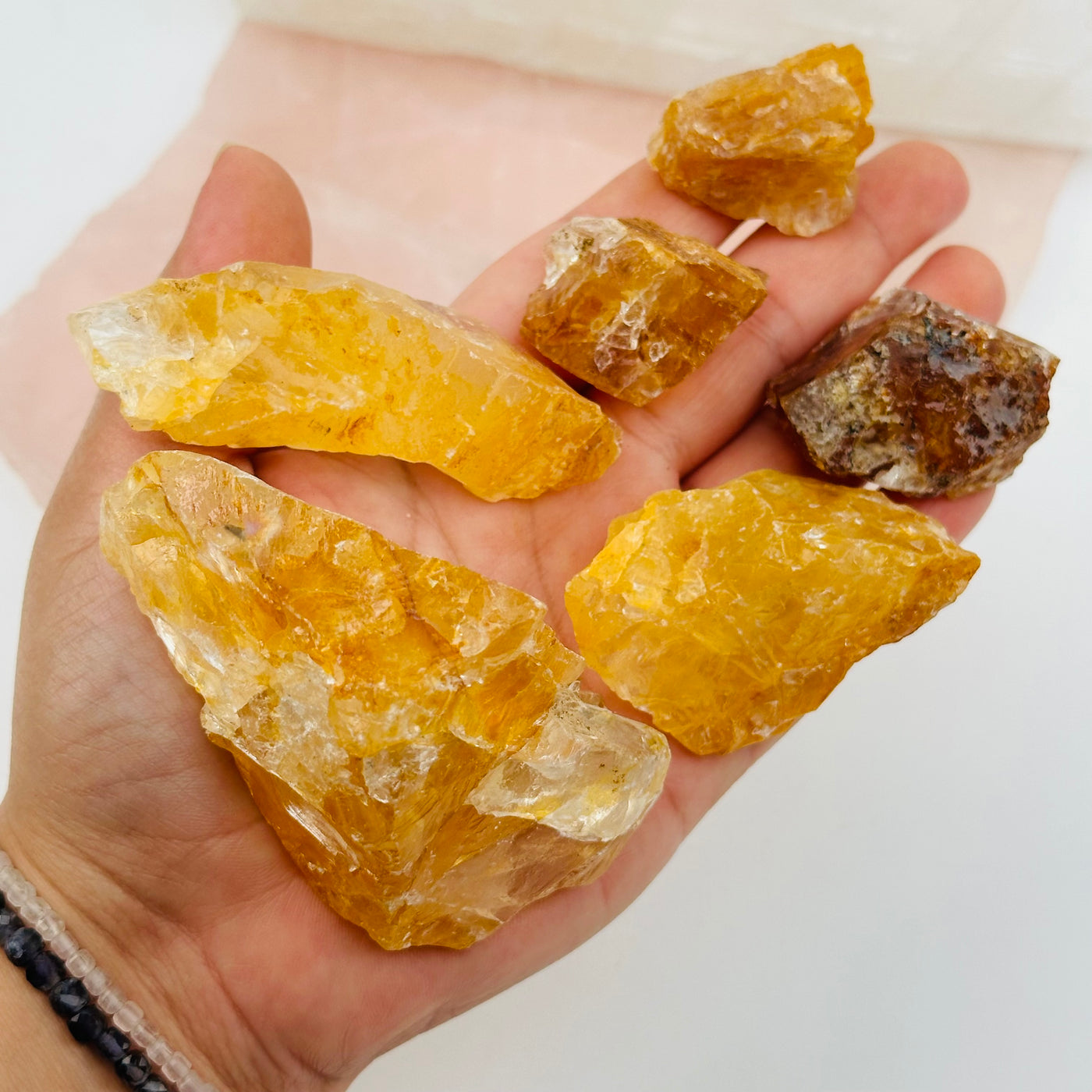 golden healer crystals in hand for size references 