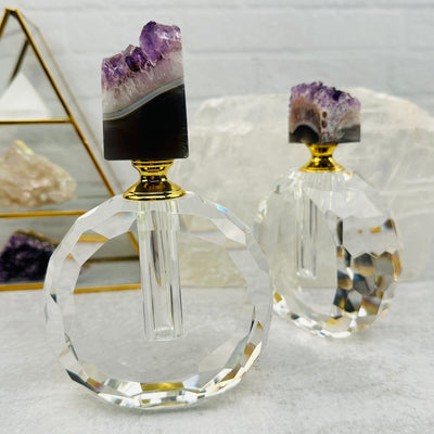 front and size view of these amethyst perfume bottles 