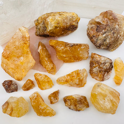 multiple crystals displayed to show the difference in the sizes and color shades