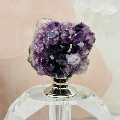 close up of the crystal clusters on this perfume bottle 