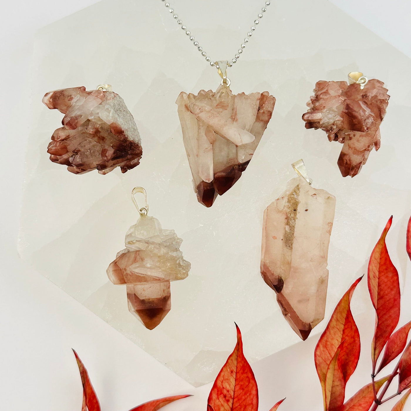 lithium quartz pendants with decorations in the background