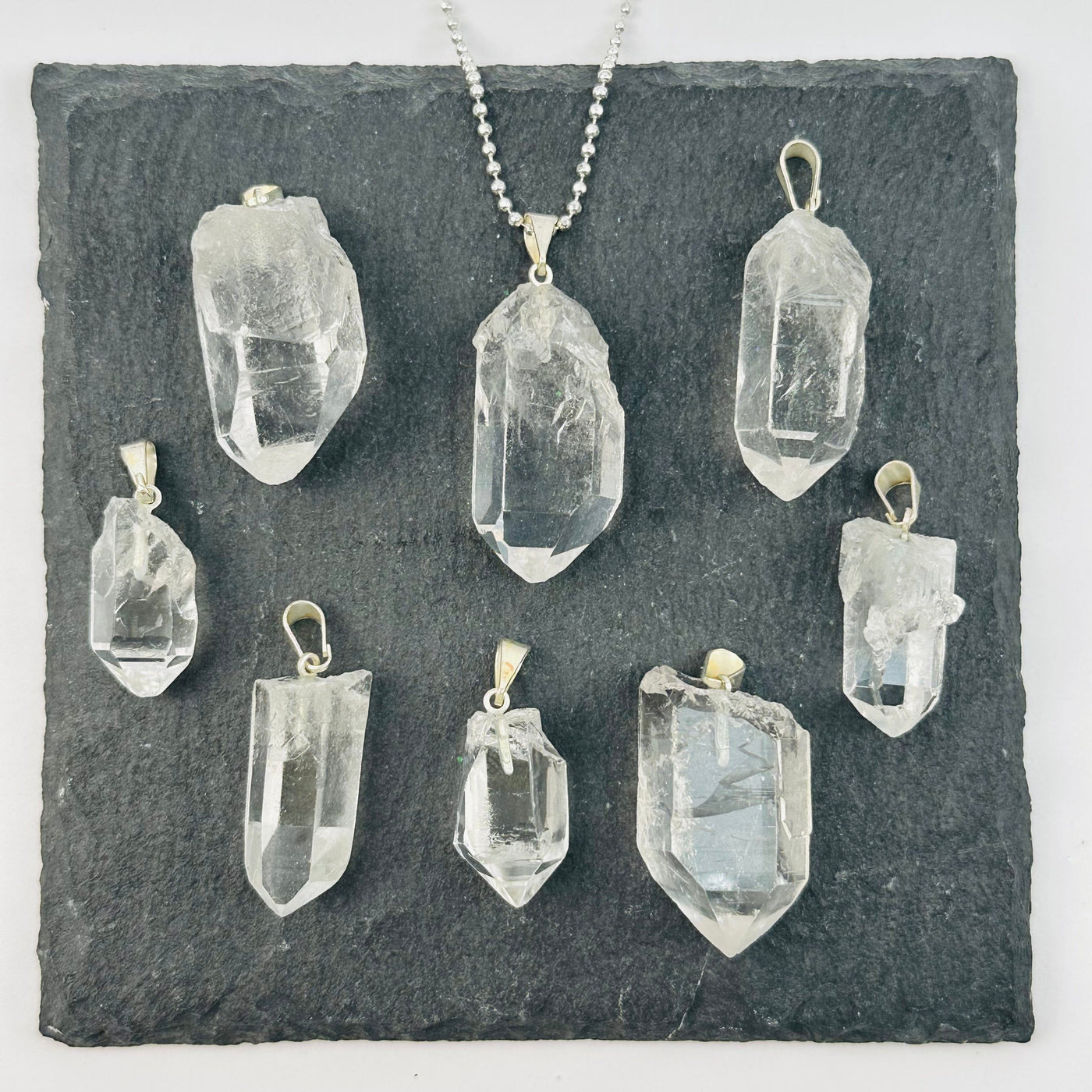 multiple pendants displayed to show the differences in the sizes 