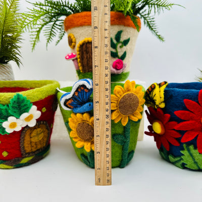 felt planters next to a ruler for size reference 