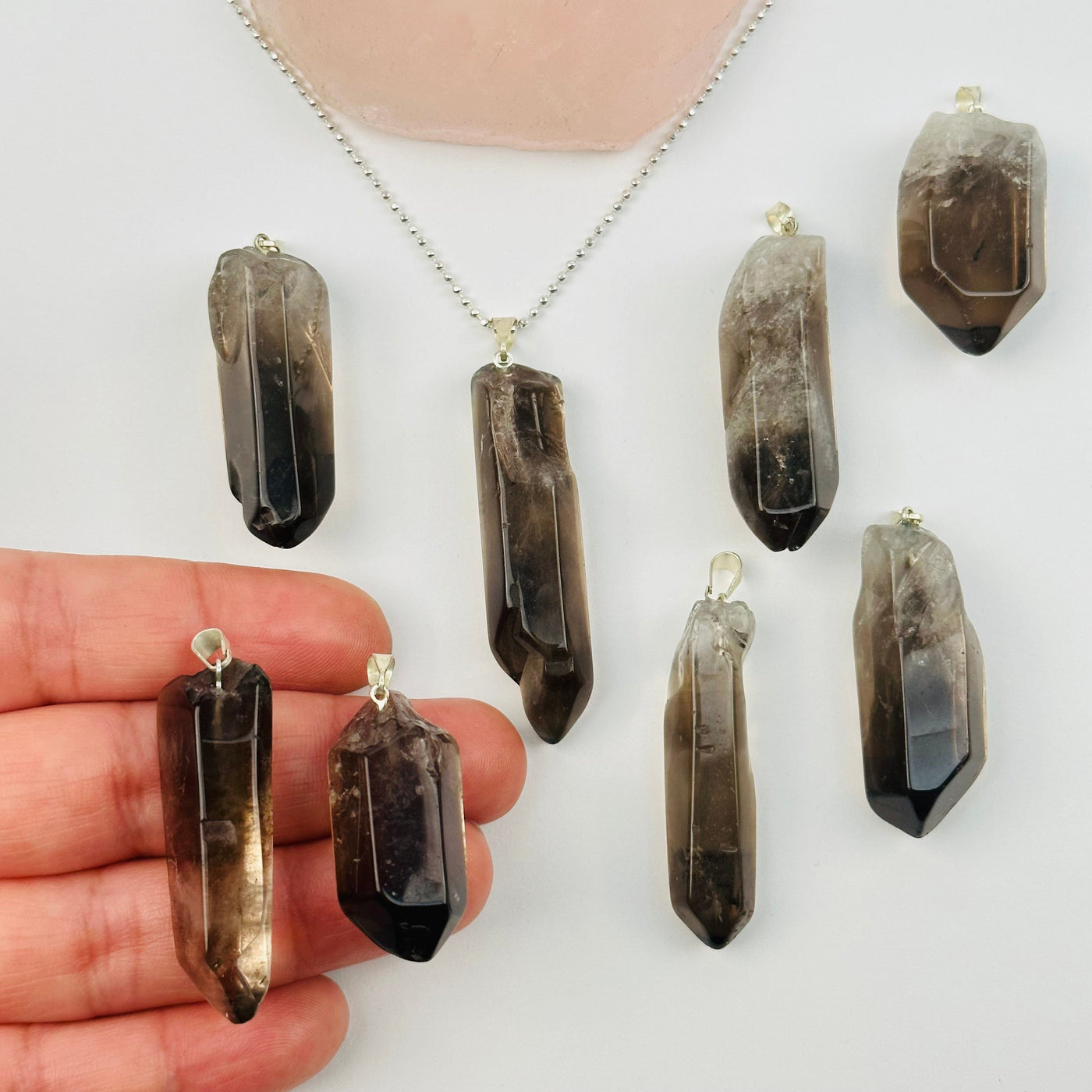 Smoky Quartz Polished Point Pendant Charm - Silver Bail in hand for size reference 
