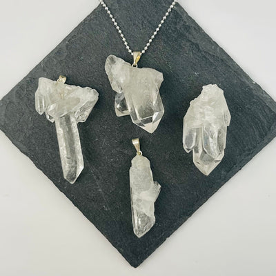 multiple pendants displayed to show the differences in the sizes