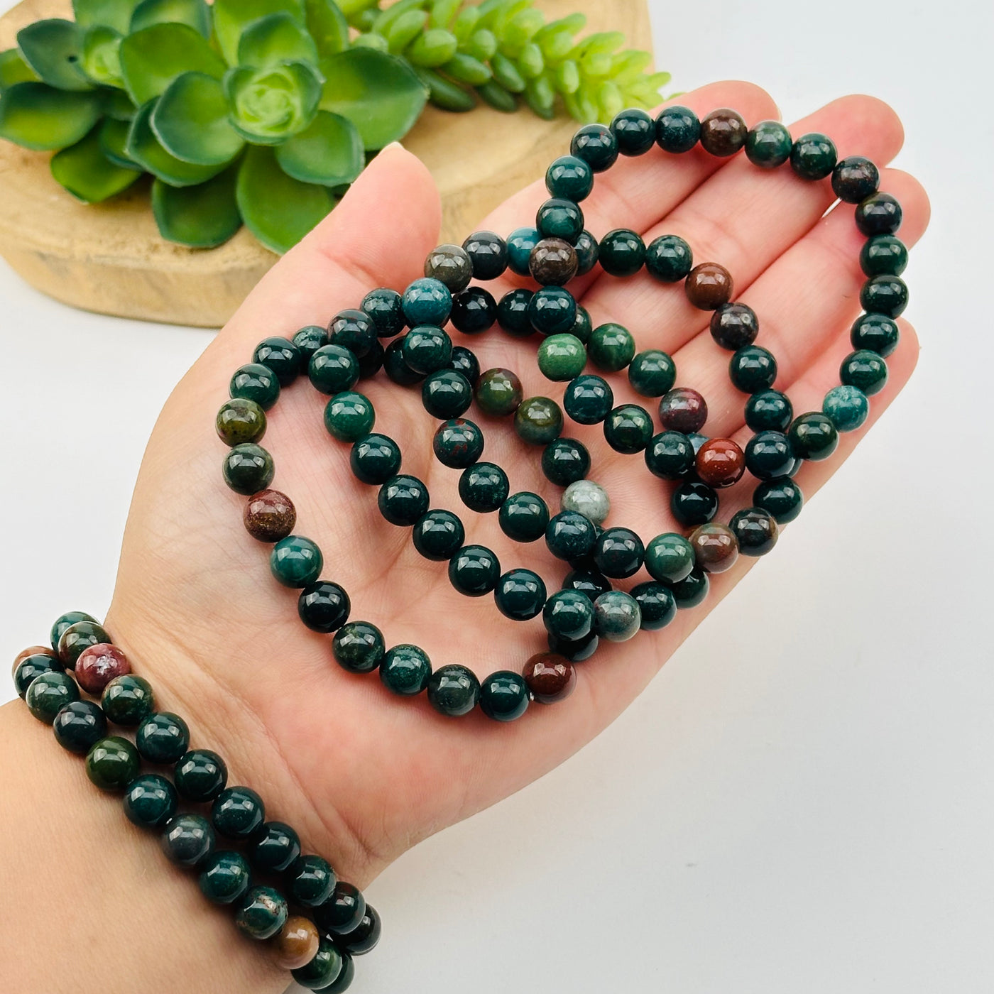 bloodstone bracelets in hand for size reference 