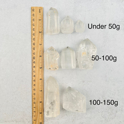 Lemurian Crystal Quartz Polished Point - CHOOSE WEIGHT next to a ruler for size reference 
