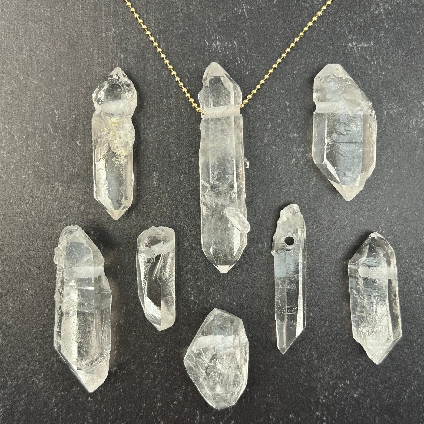 multiple pendants displayed to show the differences int he sizes 