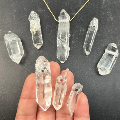 Crystal Quartz - Double Terminated Point Pendant- Top Drilled in hand for size reference 