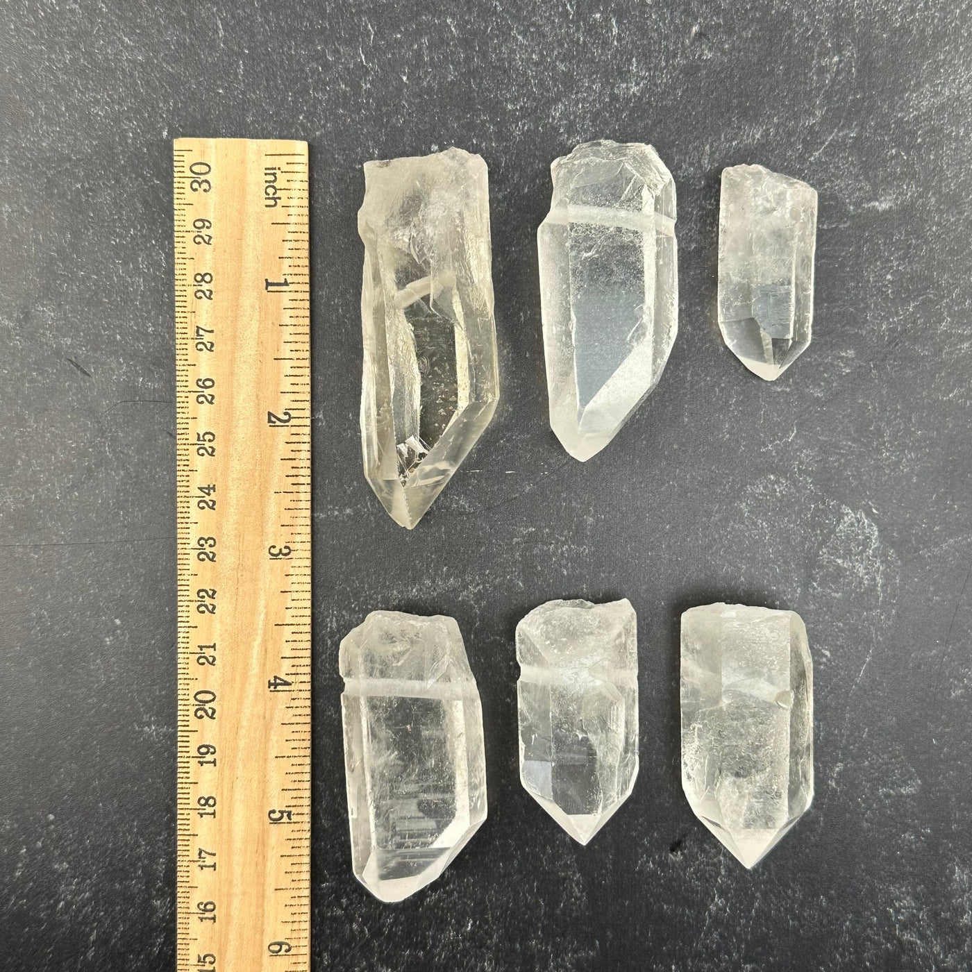 Crystal Quartz Point Rough Jumbo Size - Top Drilled next to a ruler for size reference 
