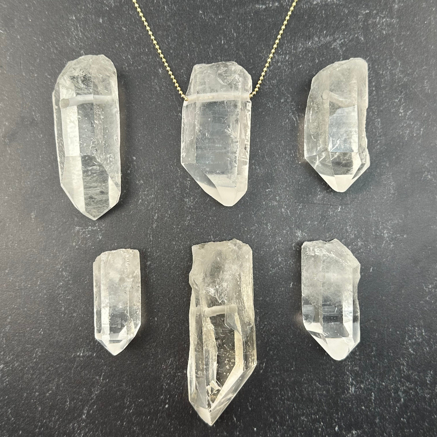 multiple pendants displayed to show the differences in the sizes 