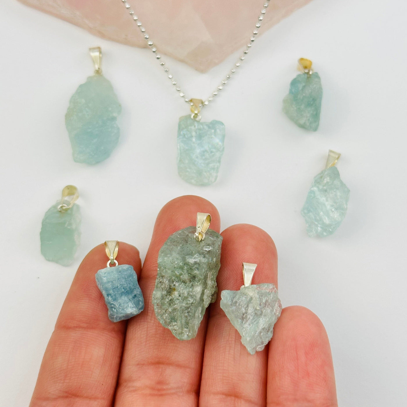 Rough Natural Crystal Stone Pendant - aquamarine - in hand for size reference