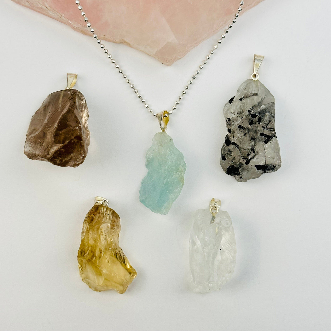 pendants displayed to show the differences in the gemstones 