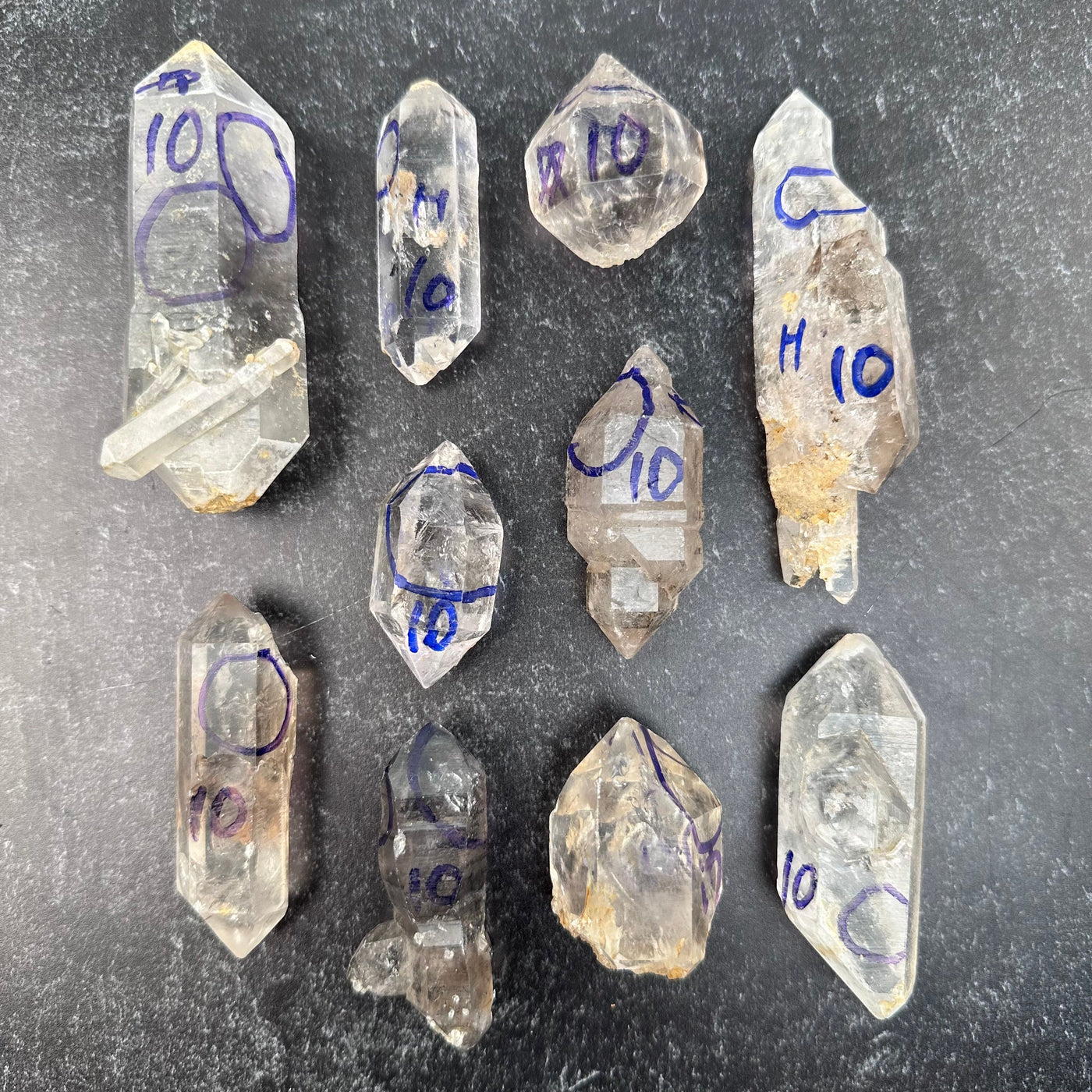 multiple crystals displayed to show the differences in the sizes. grade #10