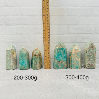 Amazonite Crystal Polished Tower Obelisk Point displayed next to a ruler for size reference