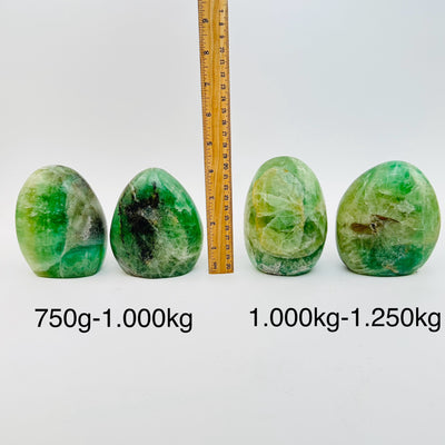 fluorite crystal cut base sold by weight - next to a ruler for size reference 