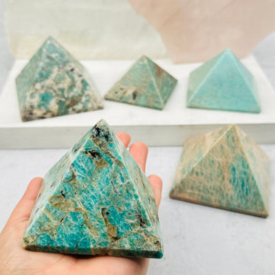 Amazonite Crystal Pyramid in hand for size reference 