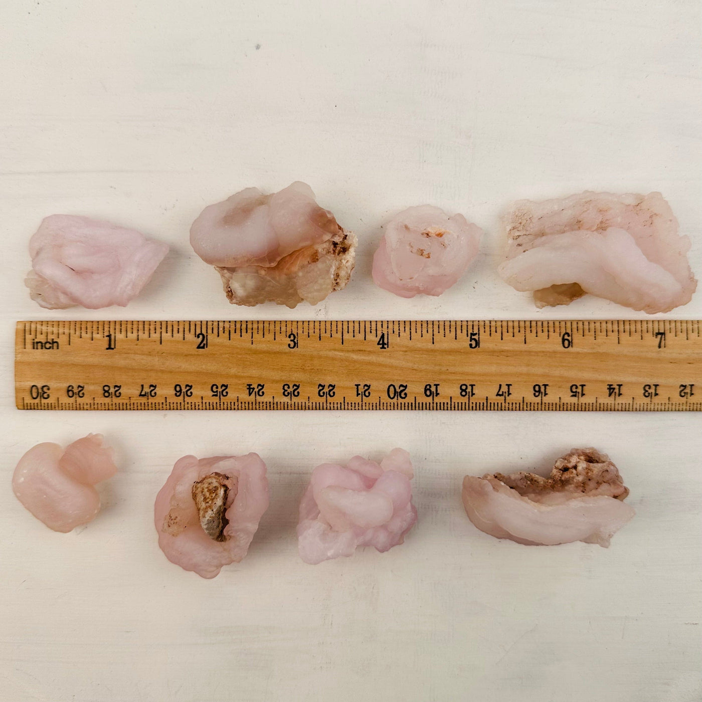 Chalcedony Rosettes - Pink Chalcedony next to a ruler for size reference 
