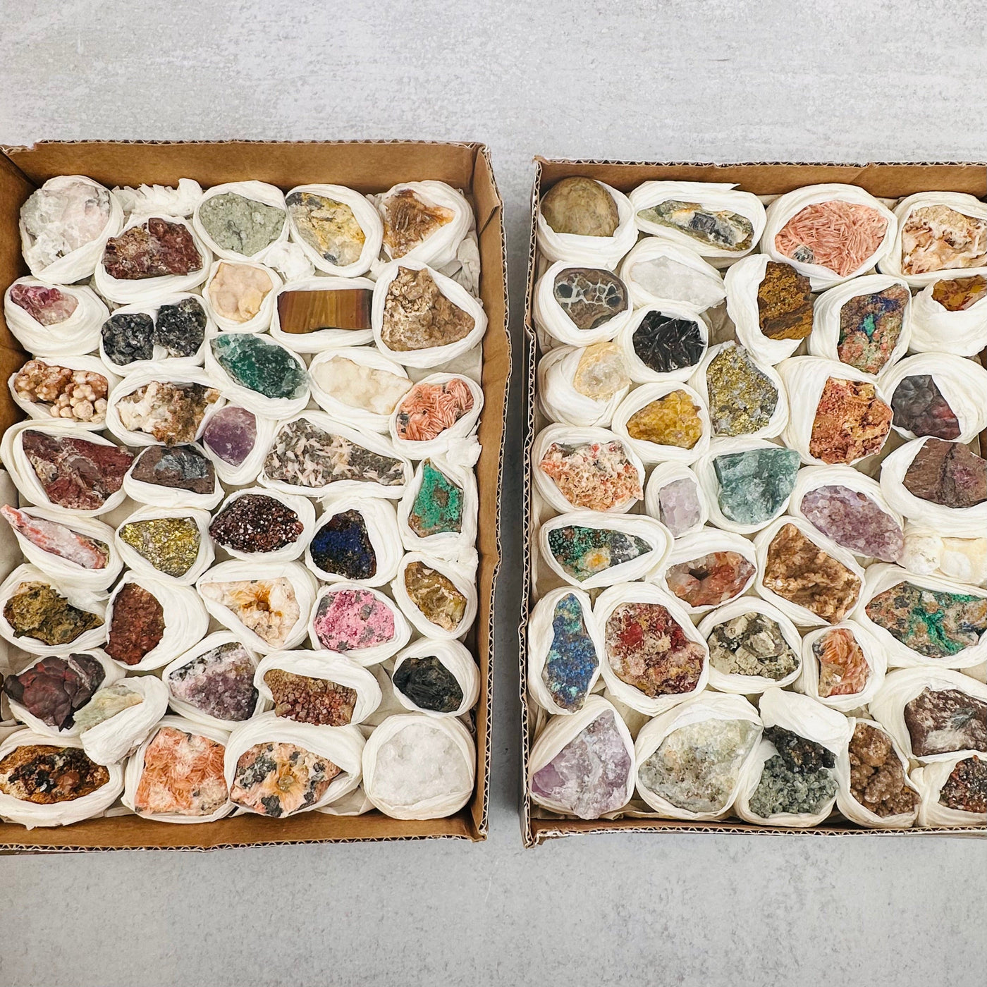 2 boxes of assorted minerals to show the variation.  Each box has a different variation of minerals.
